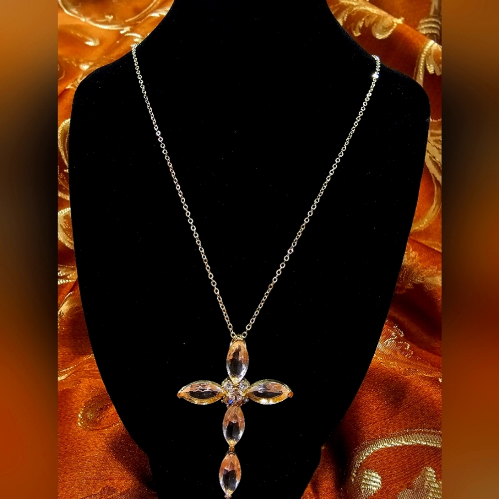 This delicate, handcrafted Moldavite cross pendant is one of a kind.